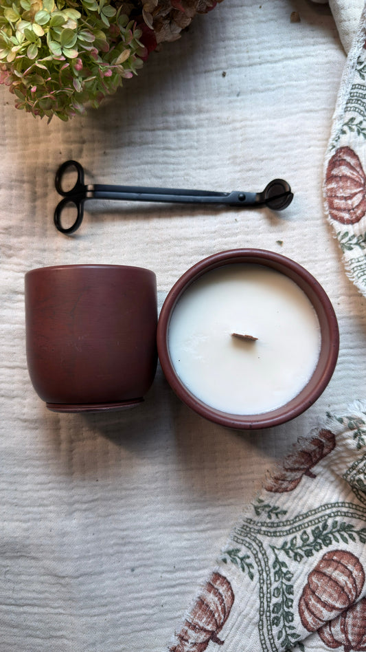 Root & Rind fall soy candle in a handmade wine-colored concrete vessel by Silk and Soul